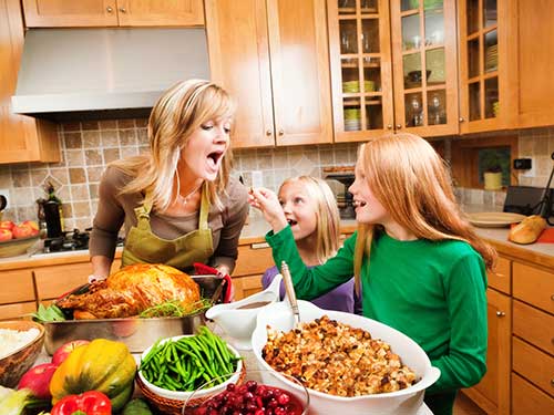 Photo: Family preparing Thanksgiving dinner.