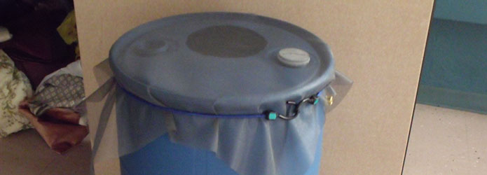closed-top rain barrel with screen covering the entire top