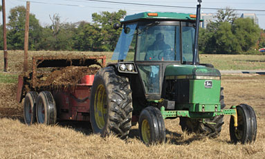 Tractor spreading manure