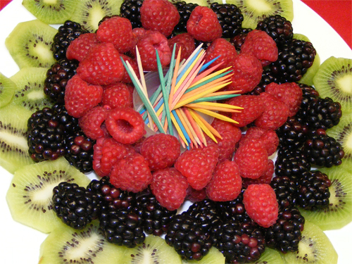 Photo: Dish with berries and Kiwi.