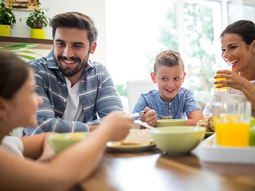 Photo: A family having breakfast together.