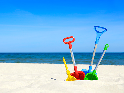 Photo: Beach toys in the sand.