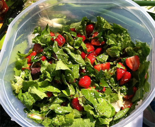 Photo: View into a salad bowl filled with strawberry romain salad.