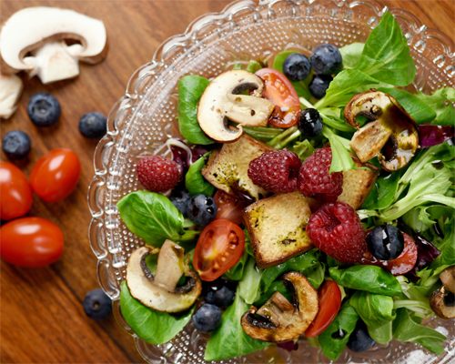 Photo: Healthy eating salad with berries mushrooms and tofu.