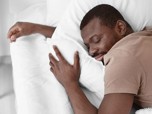 Adult male sleeping.