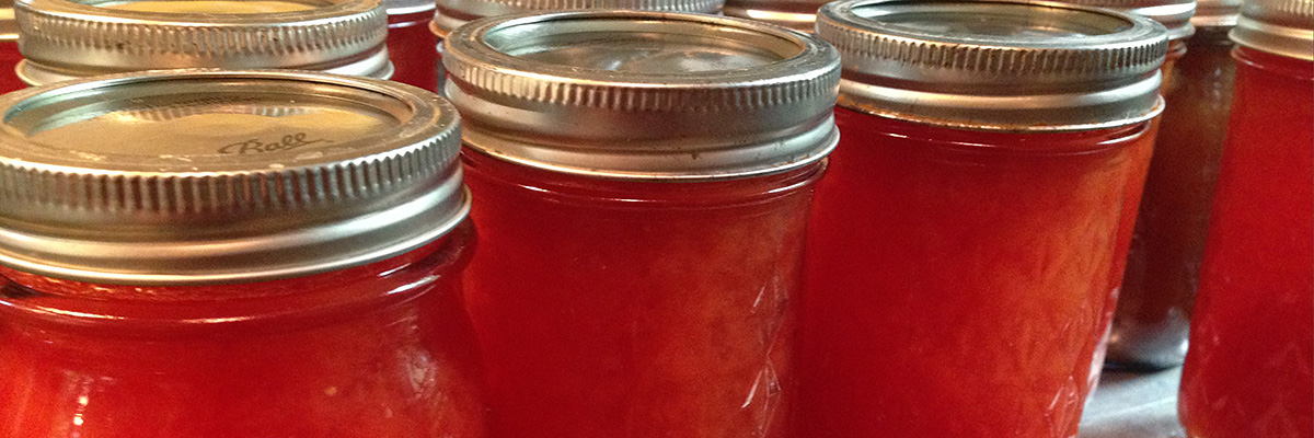 Canning jars filled with jelly.