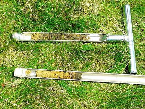 Two soil probes showing different soil profiles.